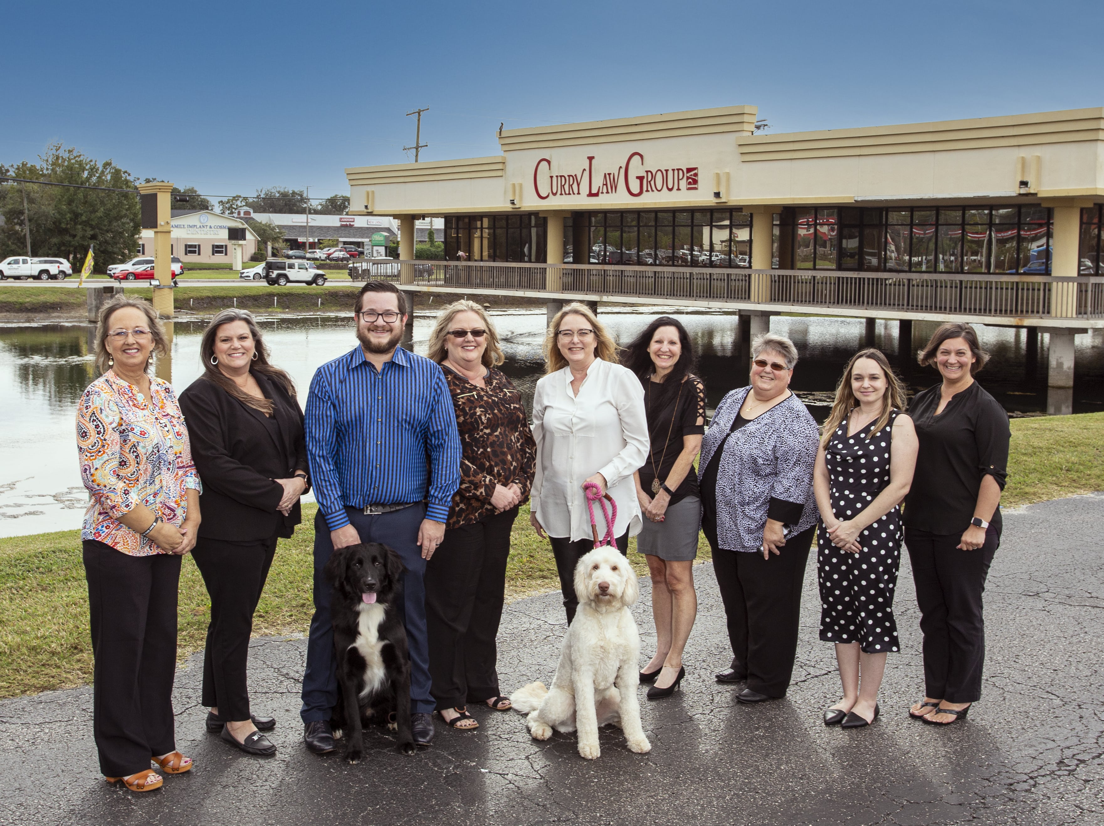 Curry Law Group PA team standing outside the front office