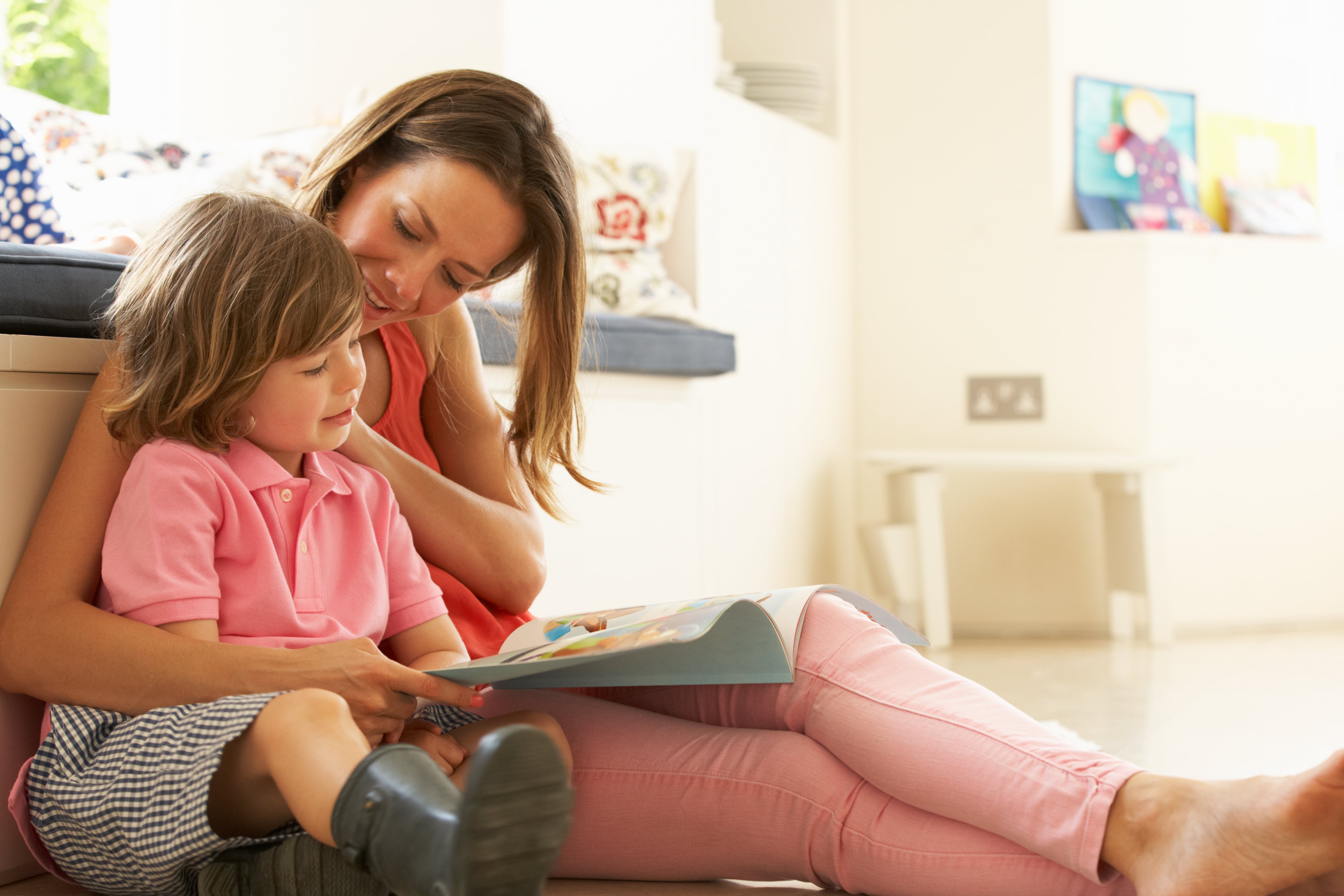 mother reading to her daughter